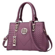 Bolsa de couro com bordado feminina