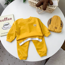 Conjuntos de roupas para bebês e crianças